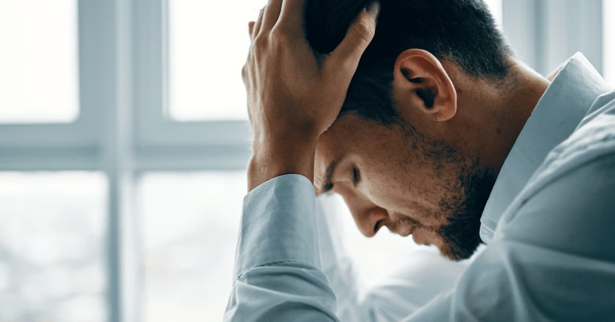 Man experiencing mental distress, representing symptoms of schizophrenia and the importance of mental health support